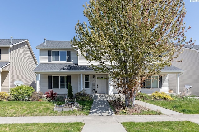view of front of home featuring a porch and a front yard