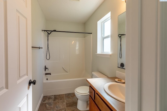 full bath featuring vanity, baseboards, toilet, and shower / washtub combination