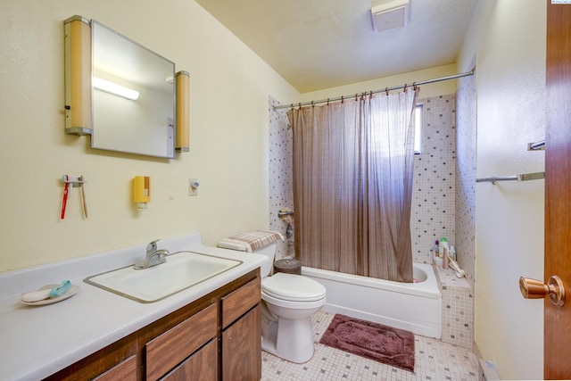 bathroom featuring tile patterned flooring, shower / tub combo with curtain, vanity, and toilet