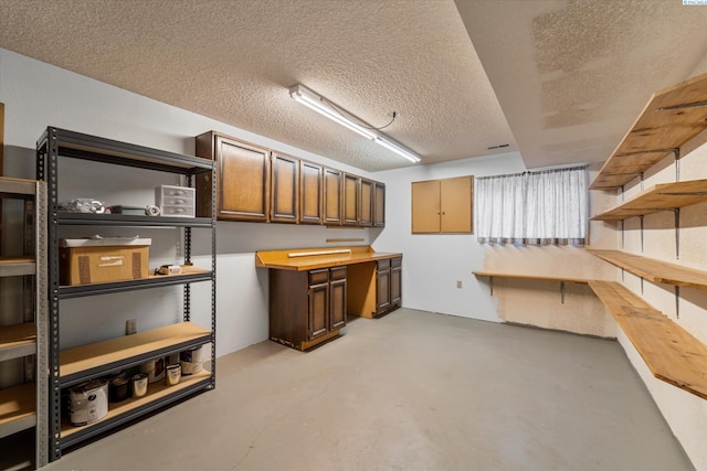 finished basement featuring a textured ceiling