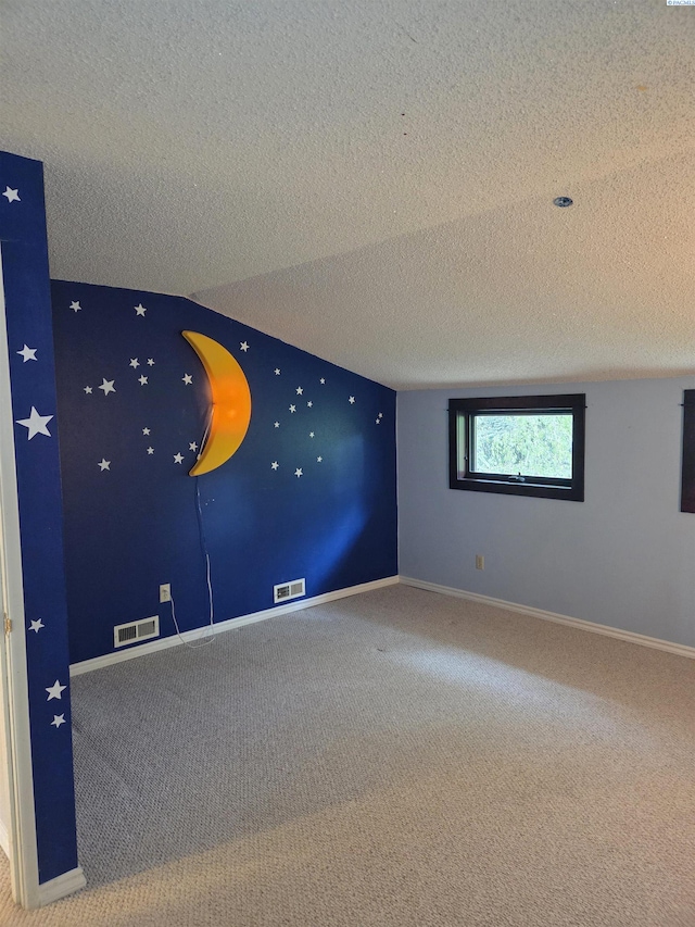 6302 Sand Rd, Pullman, WA 99163 - spare room featuring carpet flooring, a textured ceiling, and baseboards