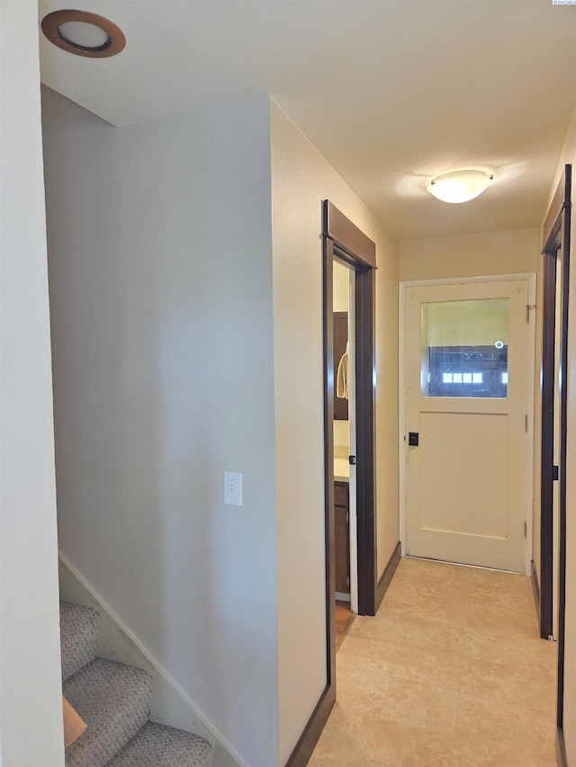 6302 Sand Rd, Pullman, WA 99163 - hallway with stairs and baseboards