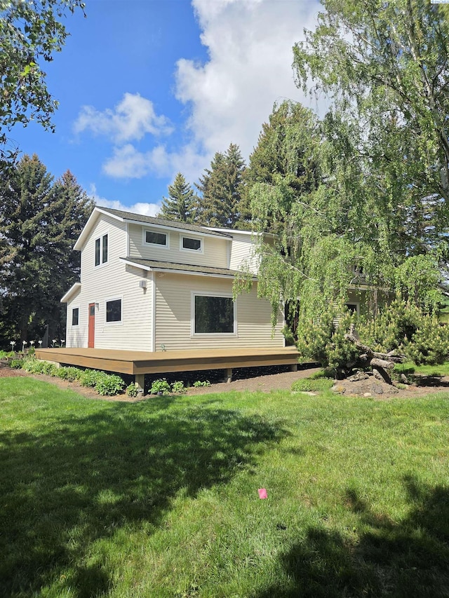 6302 Sand Rd, Pullman, WA 99163 - rear view of house with a wooden deck and a lawn
