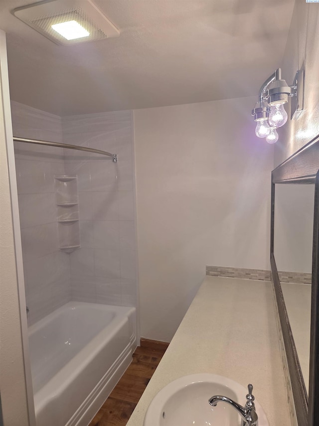 6302 Sand Rd, Pullman, WA 99163 - full bath with wood finished floors, washtub / shower combination, and a sink