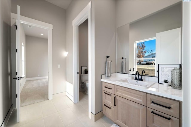 4402 Everett St, West Richland, WA 99353 - bathroom featuring tile patterned flooring, vanity, and toilet