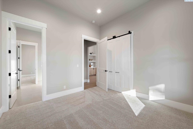 4402 Everett St, West Richland, WA 99353 - carpeted bedroom featuring a barn door