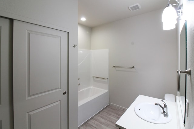 1200 N 8th Ave Unit A204, Othello, WA 99327 - bathroom featuring wood finished floors, vanity, bathtub / shower combination, and recessed lighting
