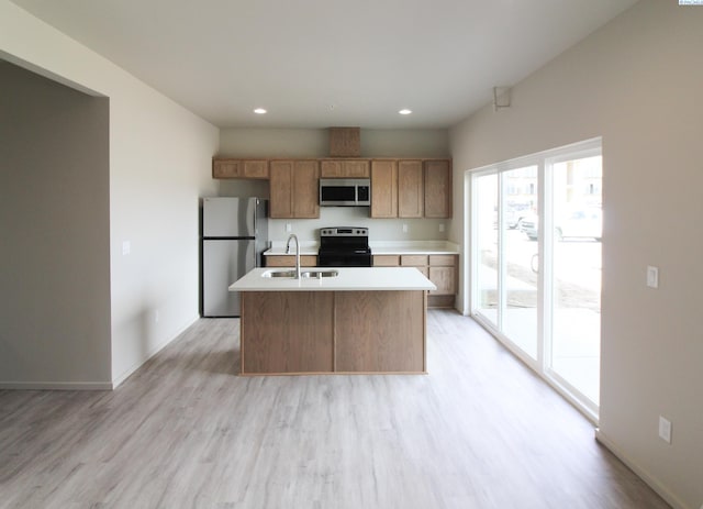 1200 N 8th Ave Unit A204, Othello, WA 99327 - kitchen featuring appliances with stainless steel finishes, light wood finished floors, light countertops, and recessed lighting