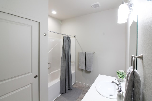 1200 N 8th Ave Unit A204, Othello, WA 99327 - full bathroom featuring wood finished floors, shower / bath combination with curtain, vanity, and recessed lighting