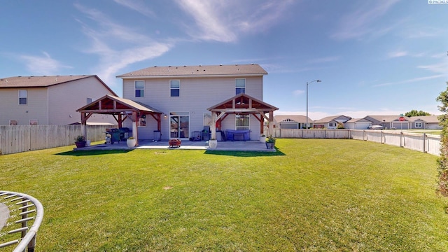 5802 Sidon Ln, Pasco, WA 99301 - back of property featuring a gazebo, a patio area, a fenced backyard, and a residential view