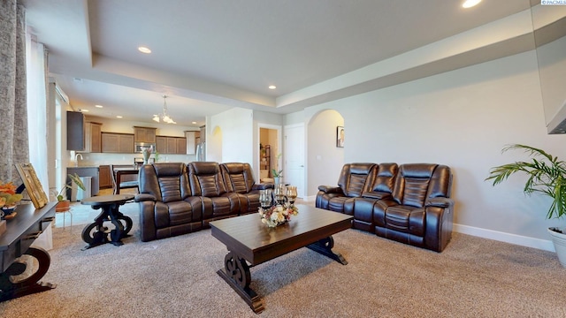 5802 Sidon Ln, Pasco, WA 99301 - living area with light colored carpet, arched walkways, recessed lighting, and a tray ceiling