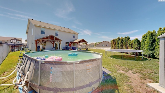 5802 Sidon Ln, Pasco, WA 99301 - view of swimming pool featuring a gazebo, a trampoline, and a fenced backyard