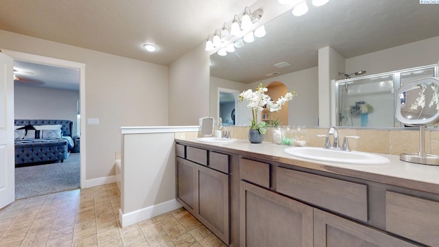 5802 Sidon Ln, Pasco, WA 99301 - ensuite bathroom featuring double vanity and a stall shower