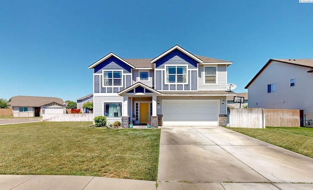 5802 Sidon Ln, Pasco, WA 99301 - craftsman-style home featuring stone siding, a garage, and concrete driveway