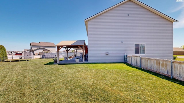 5802 Sidon Ln, Pasco, WA 99301 - back of house featuring a gazebo, a patio, and a fenced backyard