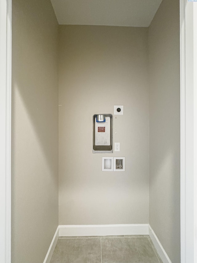 laundry area with laundry area, washer hookup, electric dryer hookup, and baseboards