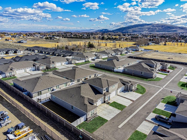 birds eye view of property with a residential view and a mountain view