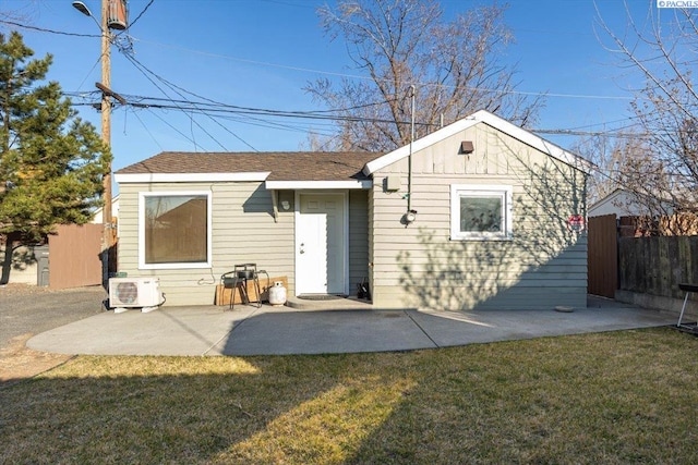 back of property featuring a yard, ac unit, a patio area, and fence