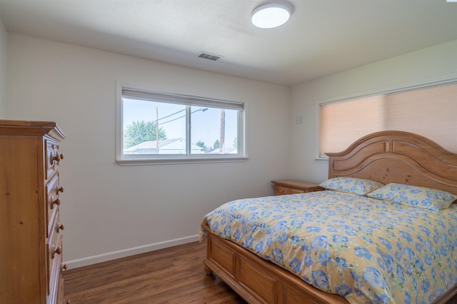 bedroom featuring dark hardwood / wood-style floors