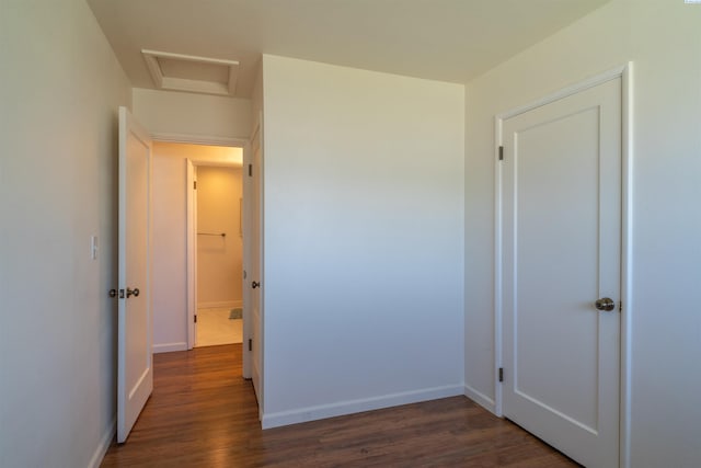 hall featuring dark wood-type flooring