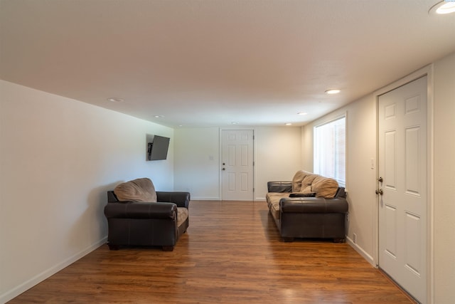 sitting room featuring dark wood-type flooring