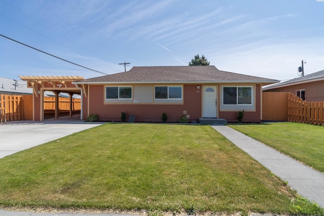 ranch-style home featuring a carport and a front lawn