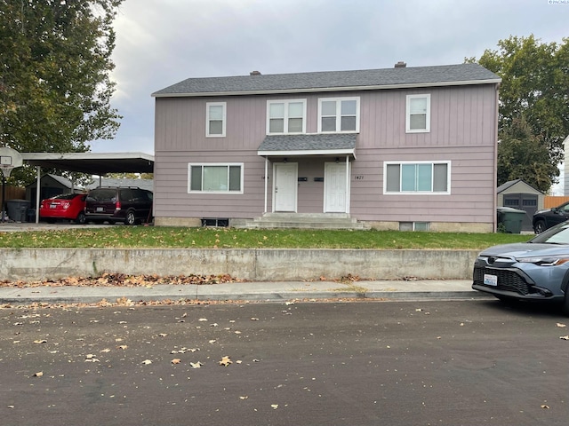 view of front of home featuring a carport