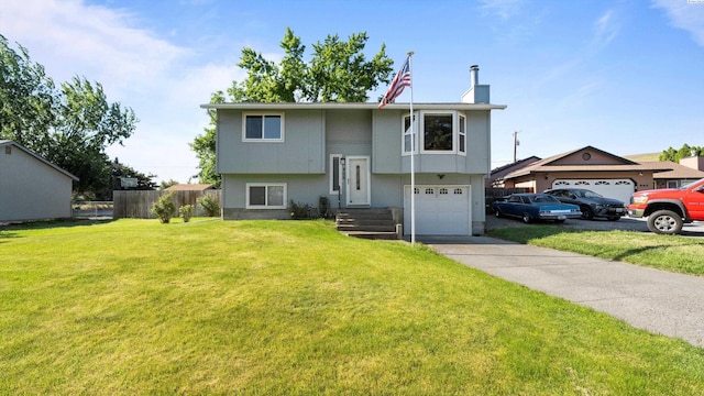 805 W 44th Pl, Kennewick, WA 99337 - raised ranch with a chimney, concrete driveway, and a garage