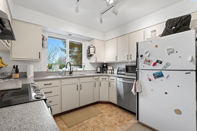 kitchen featuring a sink, extractor fan, light countertops, and stainless steel appliances