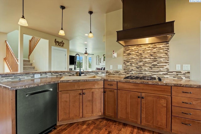 168715 W Johnson Rd, Prosser, WA 99350 - kitchen with stainless steel appliances, a sink, backsplash, dark wood-style flooring, and decorative light fixtures
