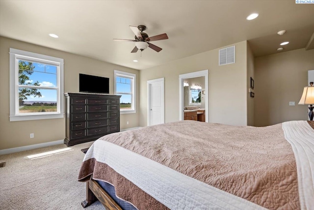 168715 W Johnson Rd, Prosser, WA 99350 - carpeted bedroom featuring baseboards, recessed lighting, ceiling fan, and ensuite bathroom