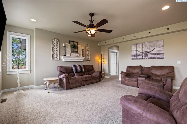 168715 W Johnson Rd, Prosser, WA 99350 - living area featuring carpet floors, a ceiling fan, baseboards, recessed lighting, and arched walkways