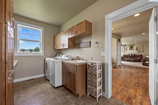 168715 W Johnson Rd, Prosser, WA 99350 - laundry room featuring cabinet space, washer and dryer, baseboards, and recessed lighting