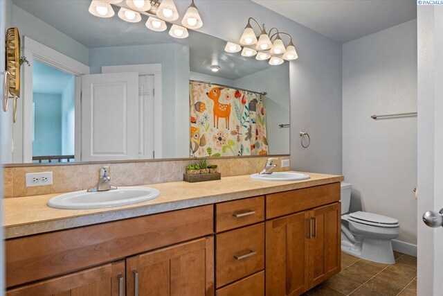 168715 W Johnson Rd, Prosser, WA 99350 - full bathroom featuring double vanity, toilet, and a shower with shower curtain