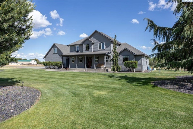 168715 W Johnson Rd, Prosser, WA 99350 - view of front of house with a porch and a front yard