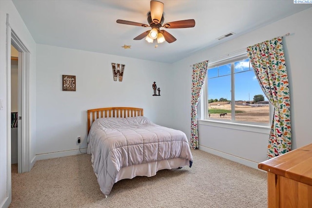 168715 W Johnson Rd, Prosser, WA 99350 - bedroom featuring light colored carpet, baseboards, and a ceiling fan