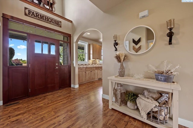 168715 W Johnson Rd, Prosser, WA 99350 - foyer entrance with wood finished floors, arched walkways, and baseboards