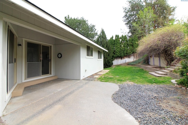 view of yard with a patio and fence