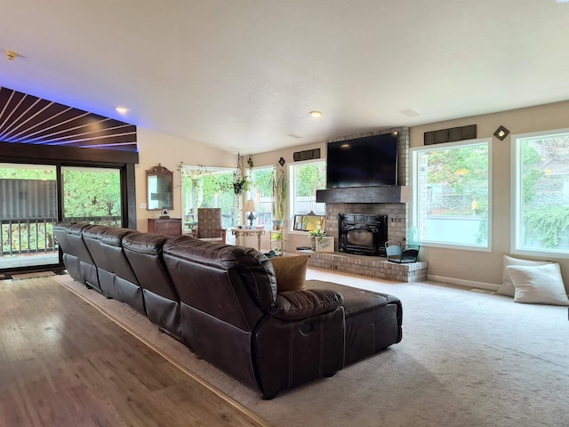 living area featuring baseboards and vaulted ceiling