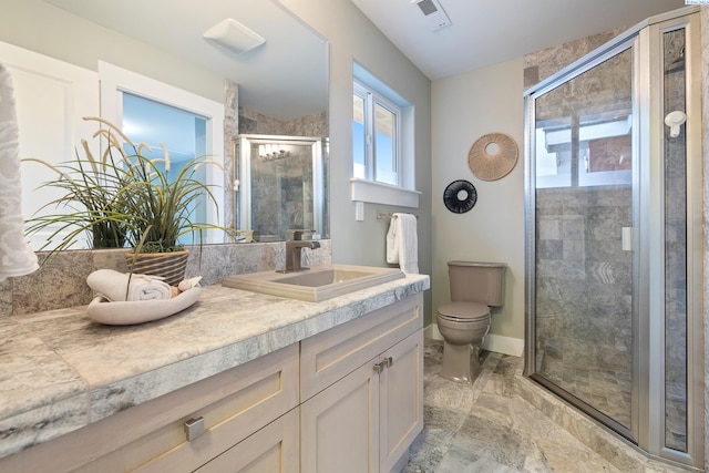 bathroom with walk in shower, vanity, and toilet