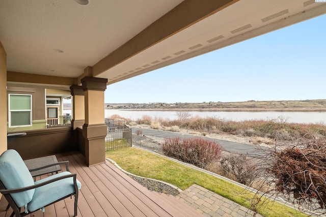 balcony featuring a water view