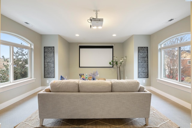 home theater featuring light colored carpet