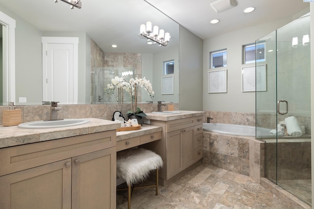 bathroom featuring vanity and separate shower and tub