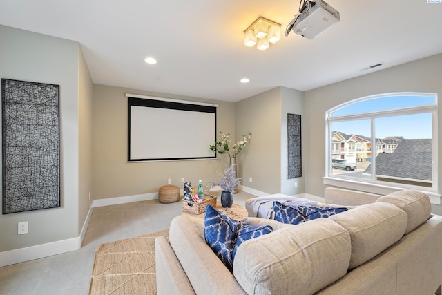 home theater with light colored carpet