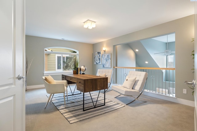 carpeted home office with ceiling fan