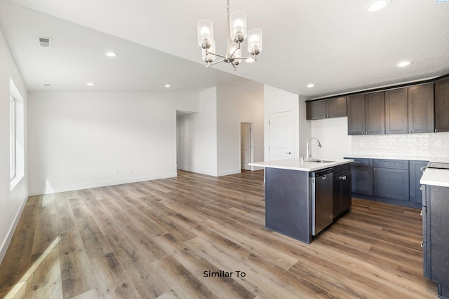 2835 S Penn St, Kennewick, WA 99338 - kitchen featuring dishwasher, a sink, light wood-type flooring, decorative backsplash, and recessed lighting