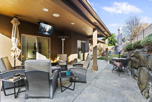 view of patio / terrace featuring fence