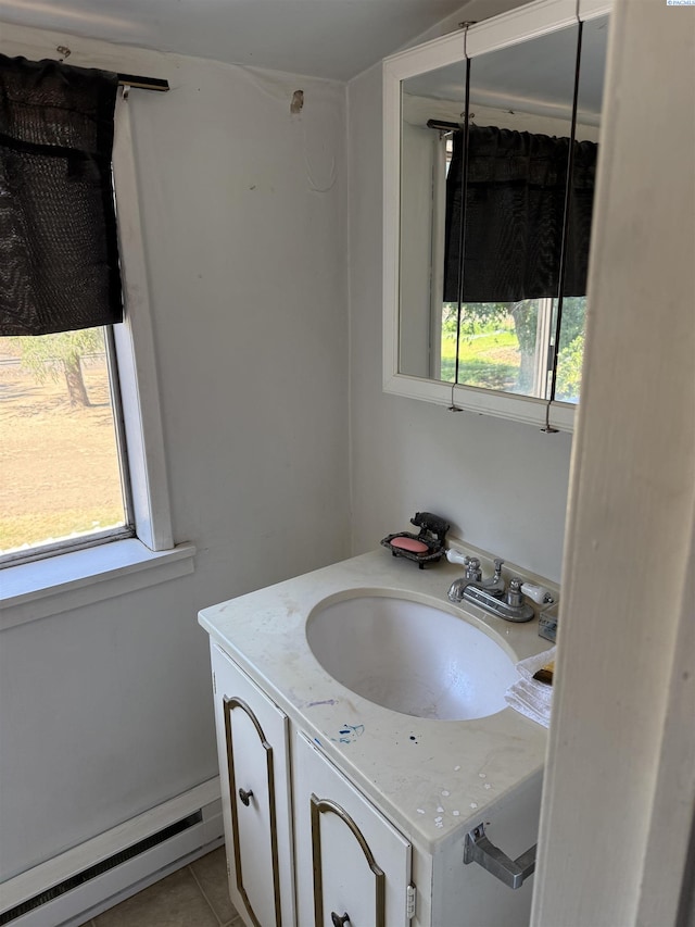 15440 W Johnson Rd, Prosser, WA 99350 - bathroom featuring baseboard heating, healthy amount of natural light, vanity, and tile patterned flooring