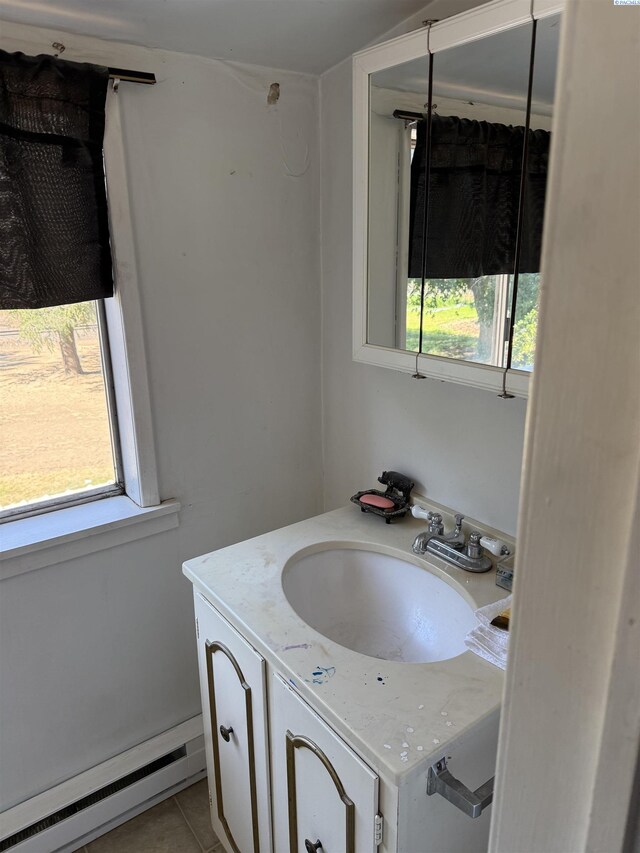 15440 W Johnson Rd, Prosser, WA 99350 - bathroom featuring baseboard heating, healthy amount of natural light, vanity, and tile patterned flooring