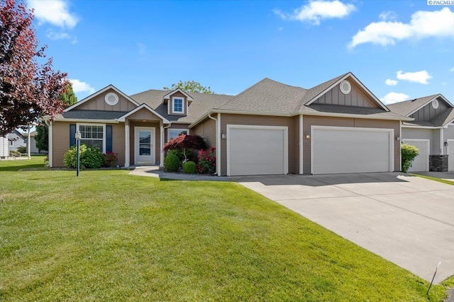 106 Muirfield Ln, Pasco, WA 99301 - view of front facade with board and batten siding, a garage, driveway, a front yard, and a shingled roof